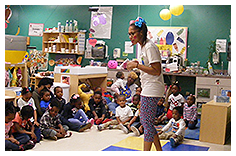 Teacher Speaking to Class of Children